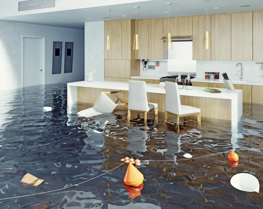 Modern kitchen interior flooded with dark water, floating debris, and overturned furniture.